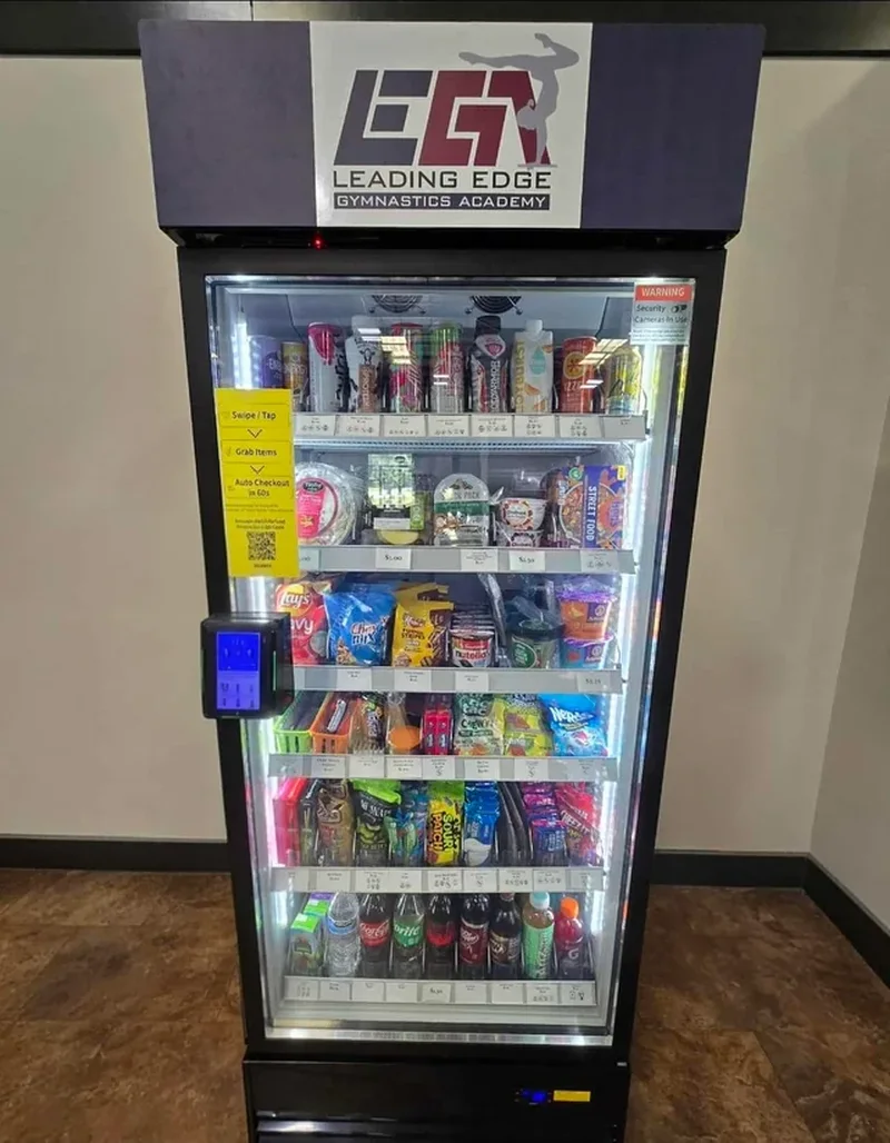 Smart cooler topped with a gymnastics academy logo