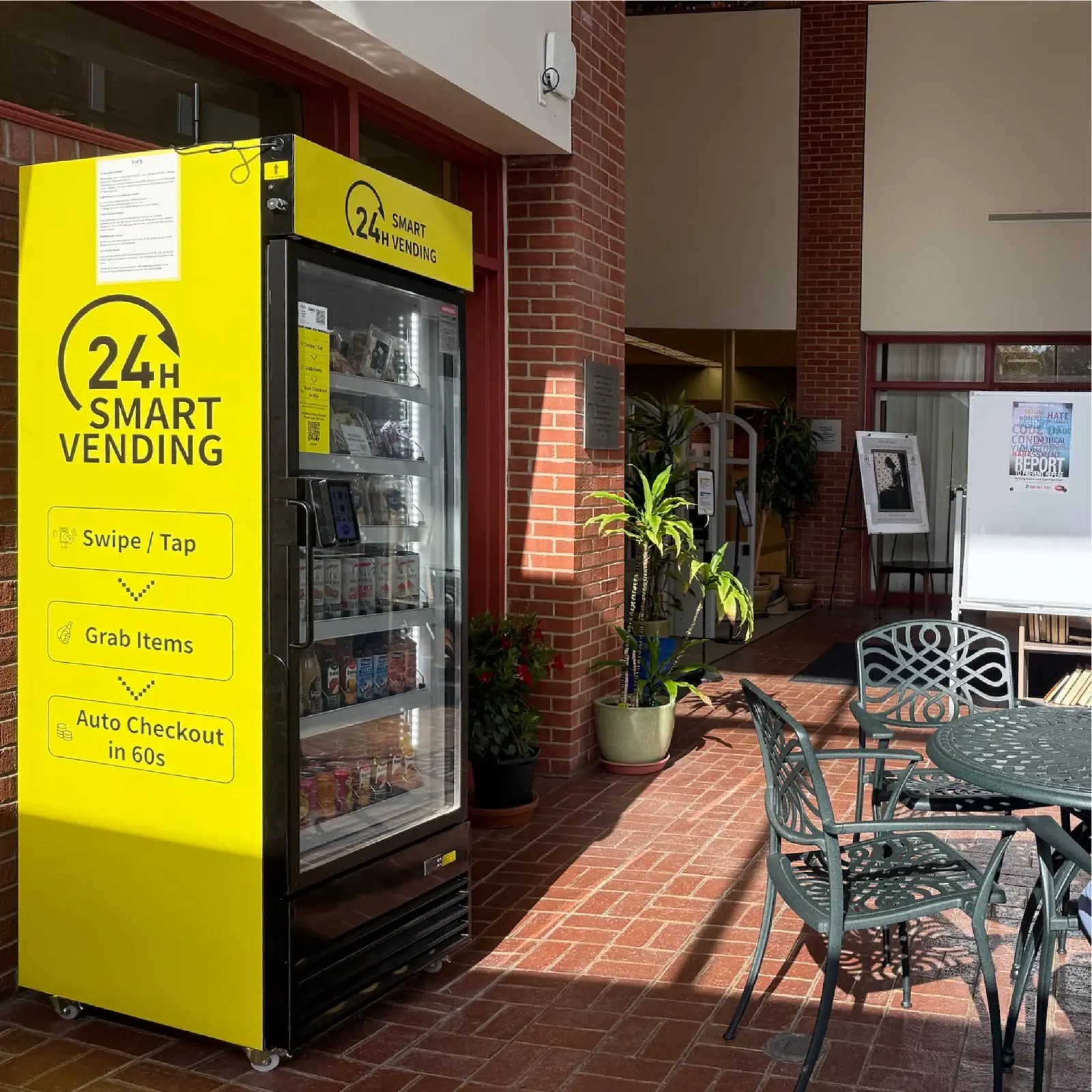 Smart cooler with a bright yellow wrap in a public building lobby