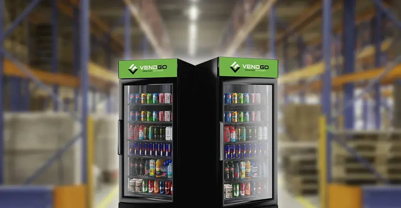 Row of six VendGO branded smart coolers in an office breakroom