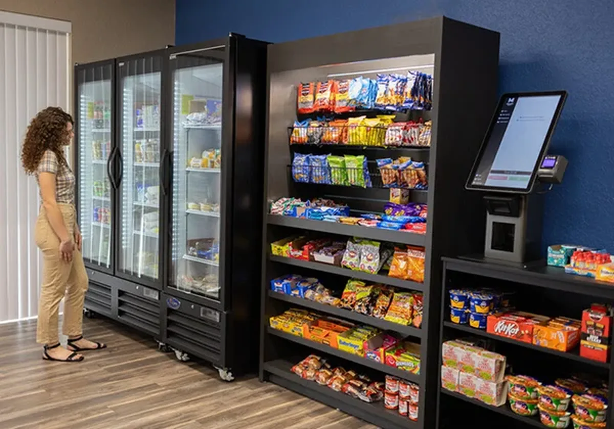 Micro market with coolers, snack racks and a self-checkout kiosk